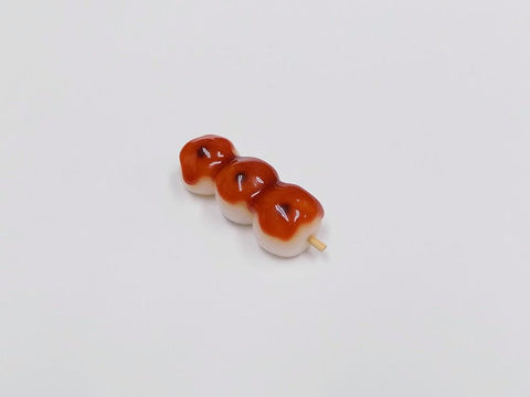Toasted Dumplings Covered in a Soy & Sugar Sauce (3-piece with Skewer) Magnet